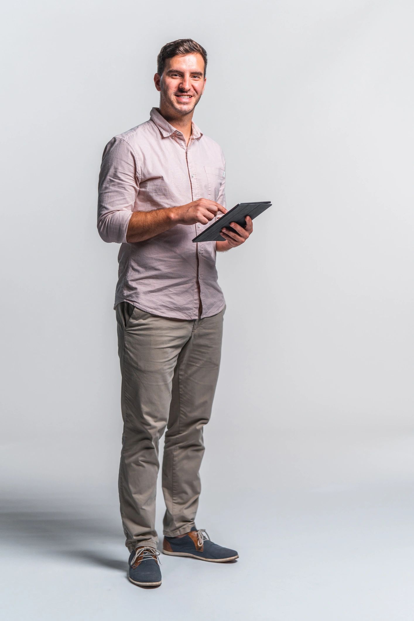 Portrait of a technology executive holding a tablet
